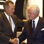 George H.W. Bush shook hands with Senator Edward M. Kennedy in 2003 during an event in College Station, Texas.
